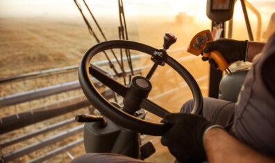 Farmer driving a tractor in a field