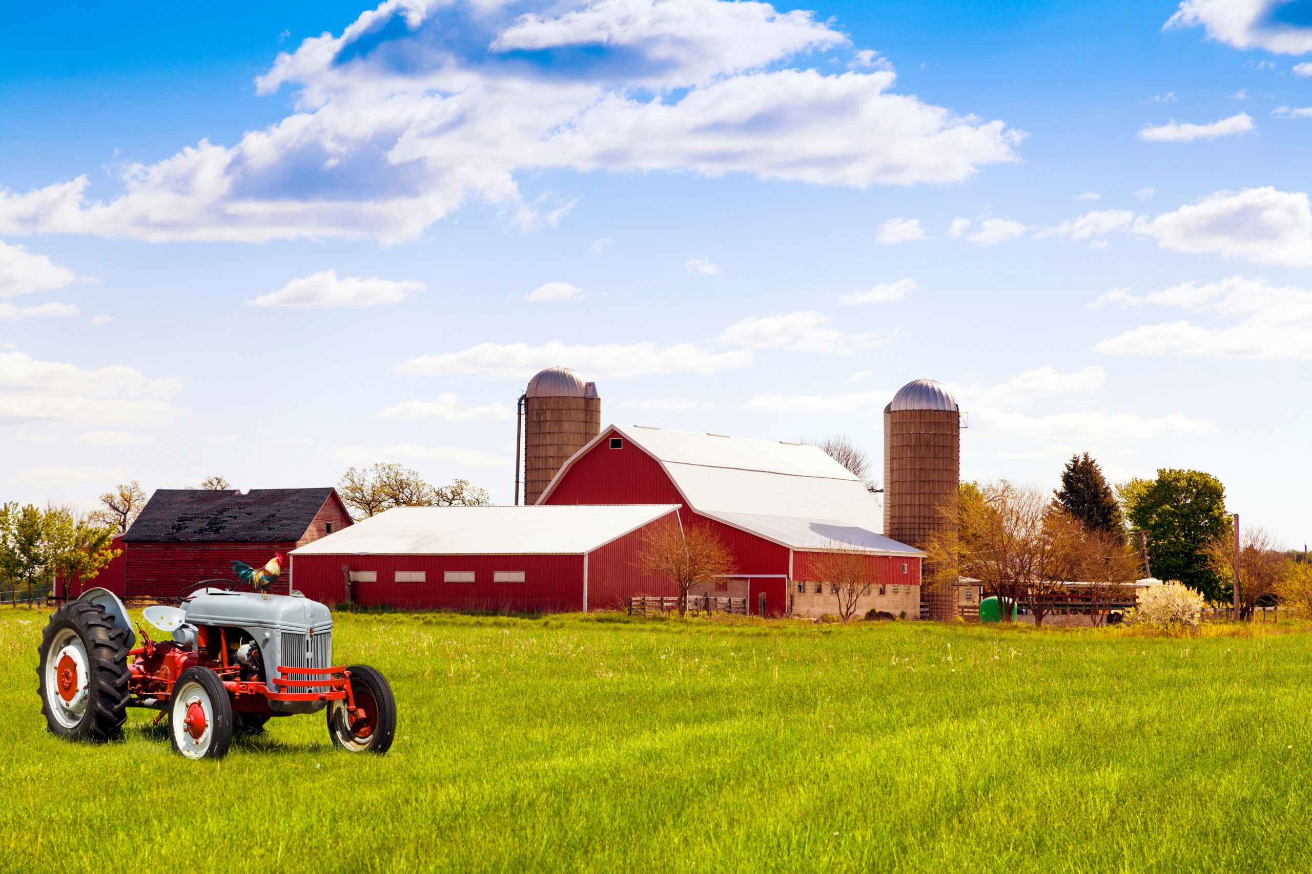 Traditional american red farm with tractor